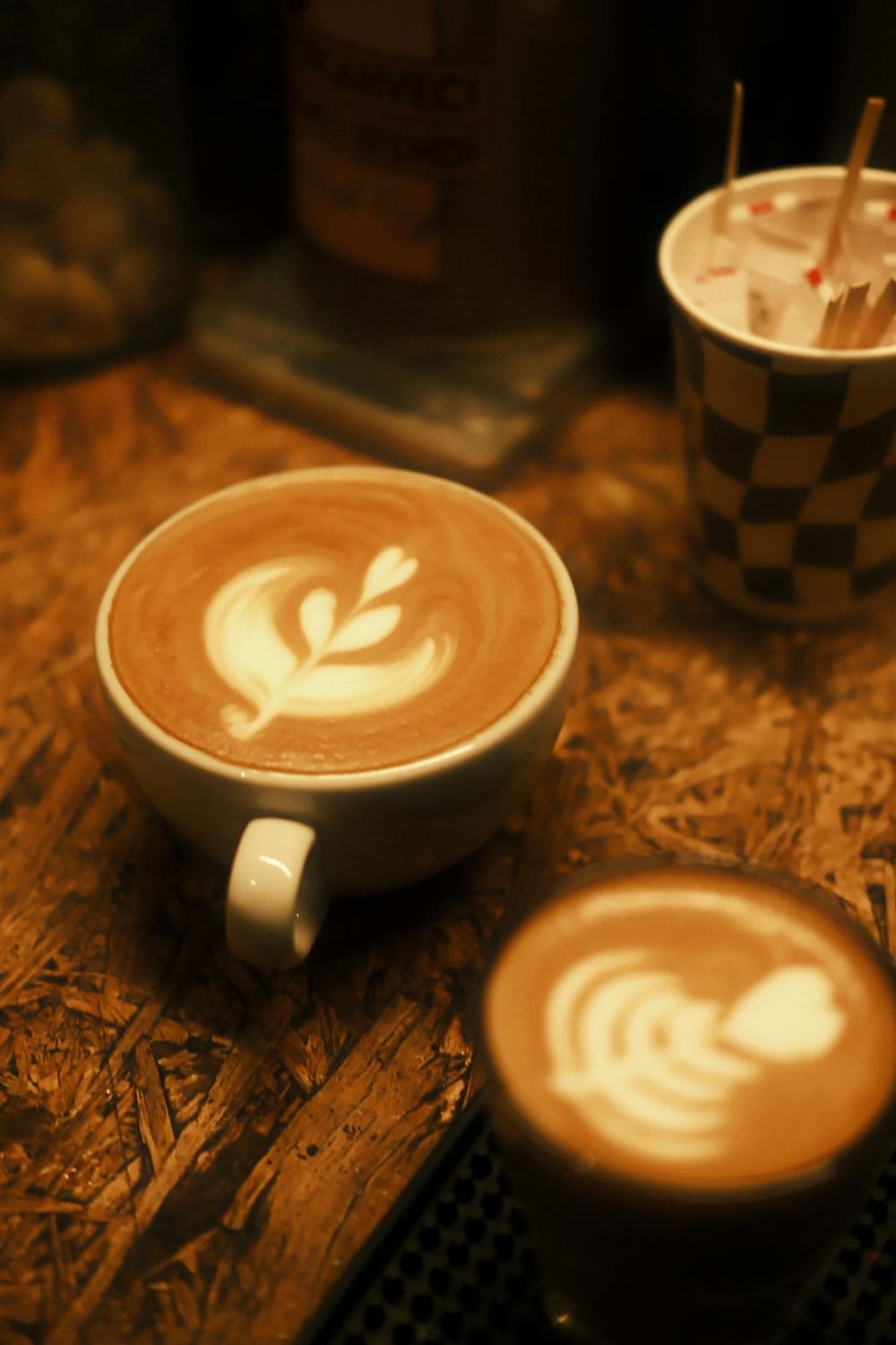 A freshly poured latte in a warm cafe