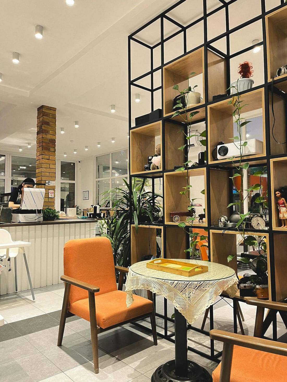 The warm, plant-filled interior of That Coffee Place