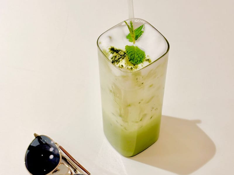 An iced matcha latte in a glass